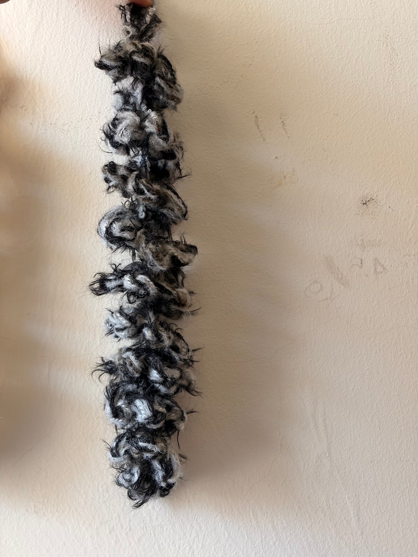 Black and white textured strip on a beige surface
