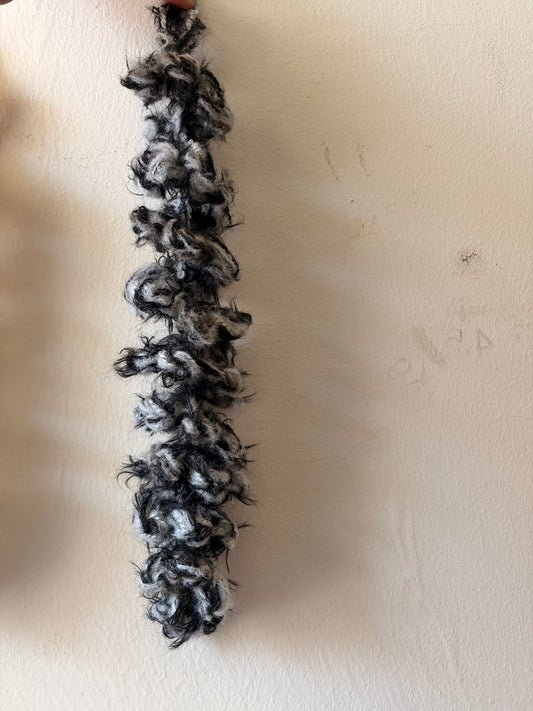 Black and white textured strip on a beige surface